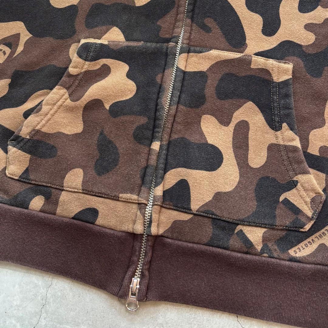 PEARLY GATES 迷彩カモフラ総柄 ジップフードパーカー にこちゃん刺繍